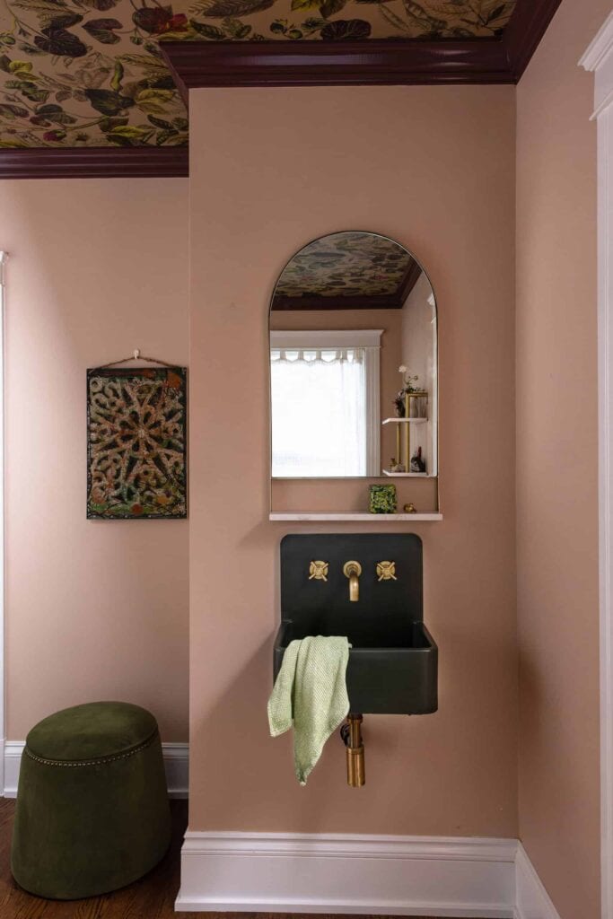 A new sink and mirror in the remodeled primary bedroom