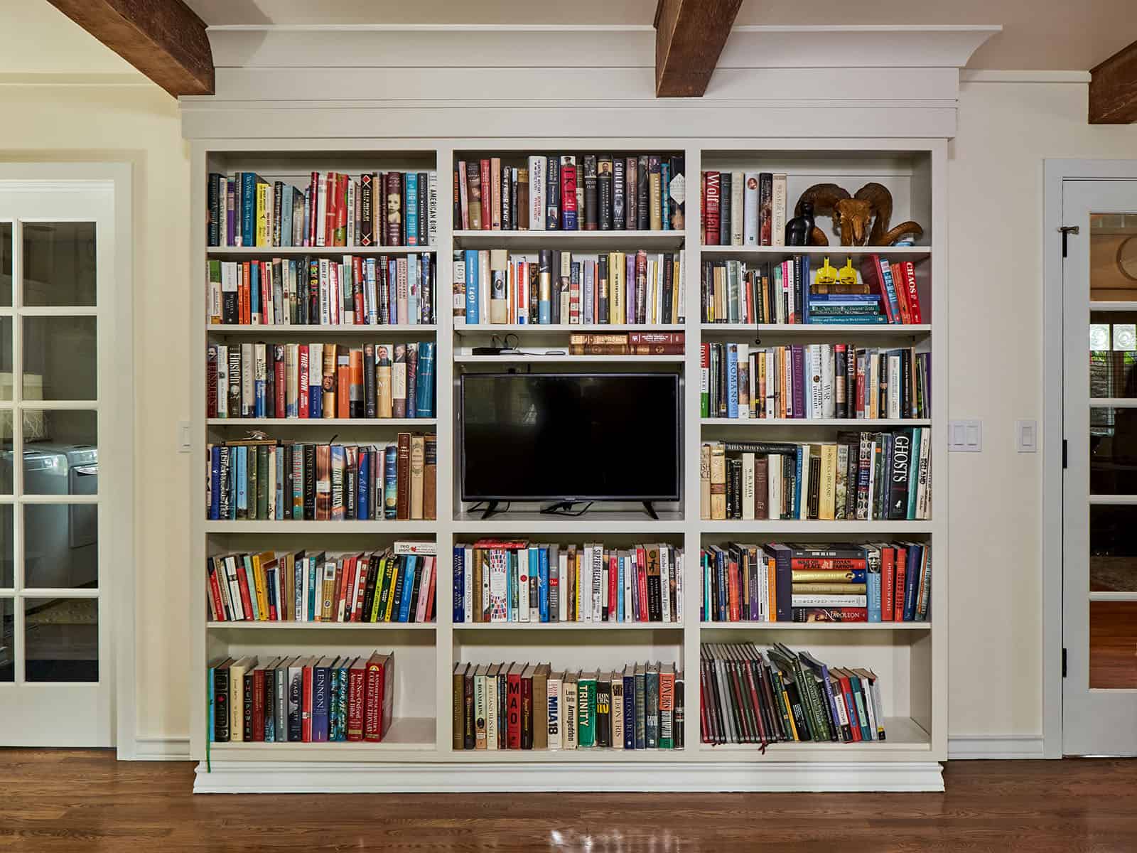 Bookcase incorporated into the Living Room adjacent to the kitchen.