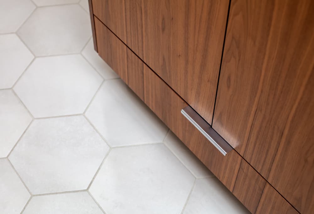 Bathroom floor with white hexagonal floor tile.