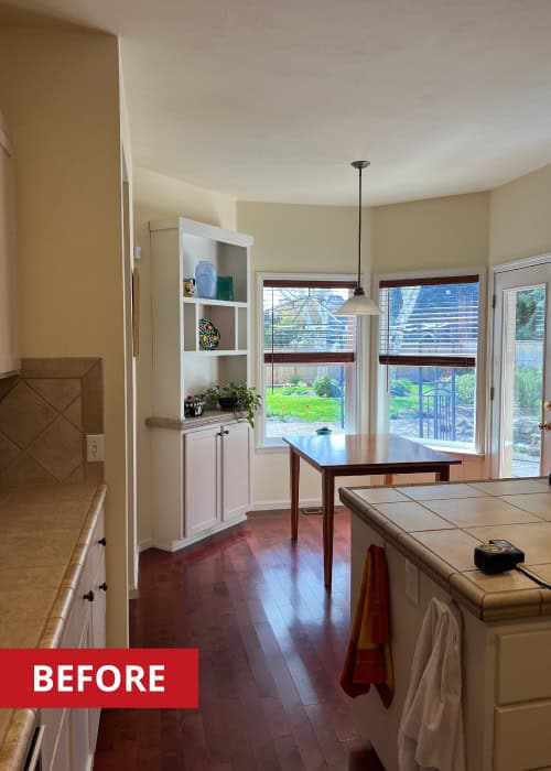 Kitchen island with a square tiled countertop.