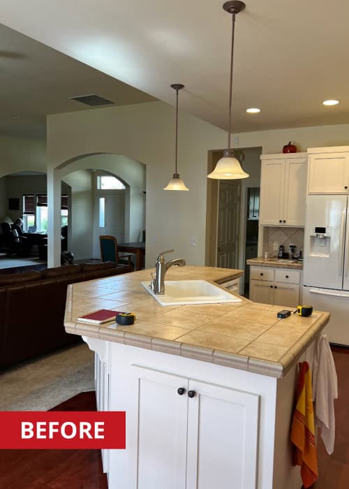 Kitchen island with white cabinet doors below.