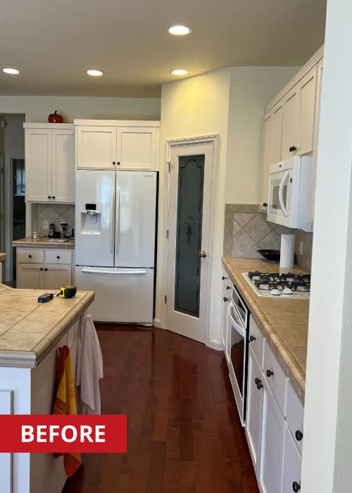 Kitchen island with white cabinet doors below.