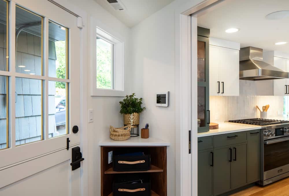 Corner shelf with two shelves built to the right of a door.