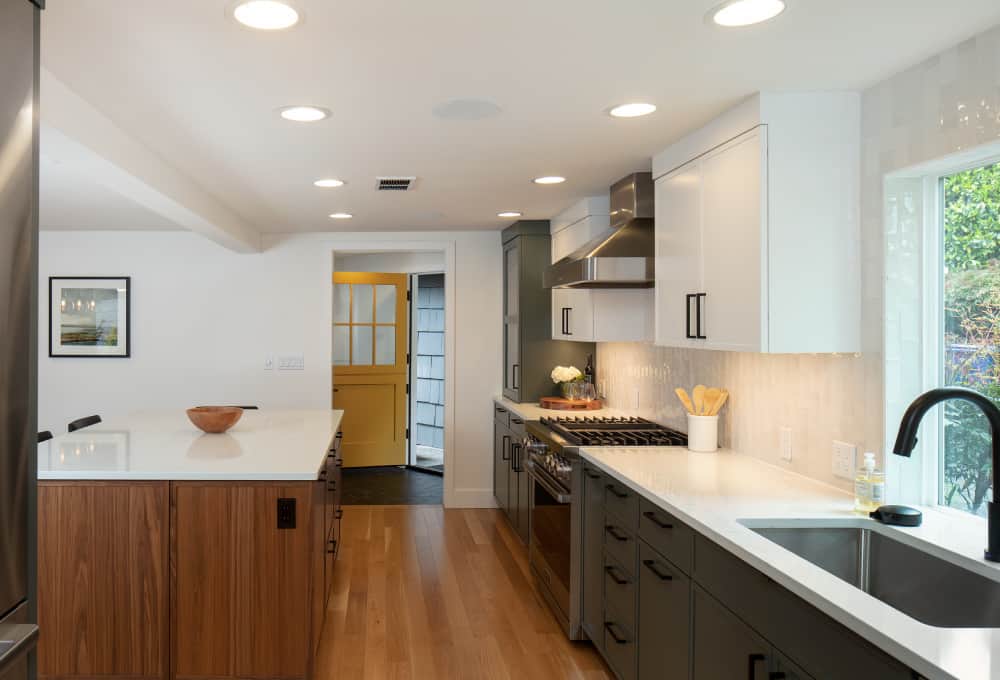 Kitchen entryway with the countertop and shelves to the right.