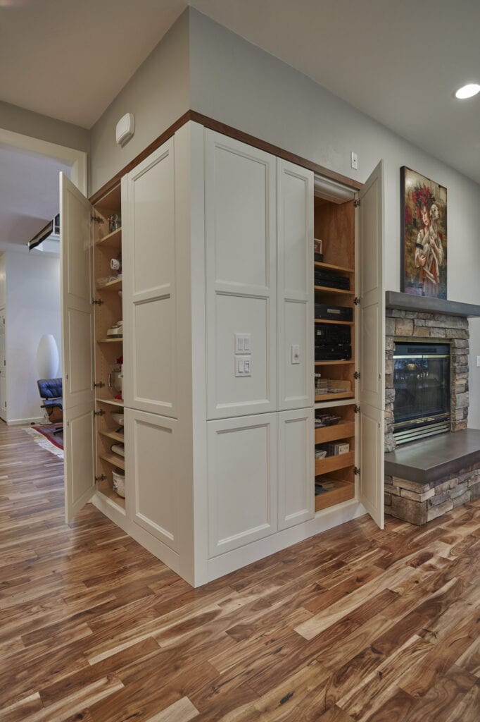 Full-height painted pantry cabinet, capped with walnut trim to match the upper cabinets.