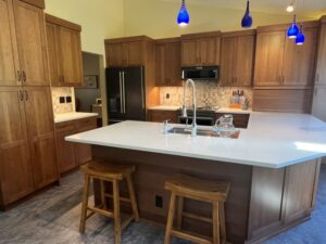 A remodeled G-shaped kitchen with workspace for three cooks 