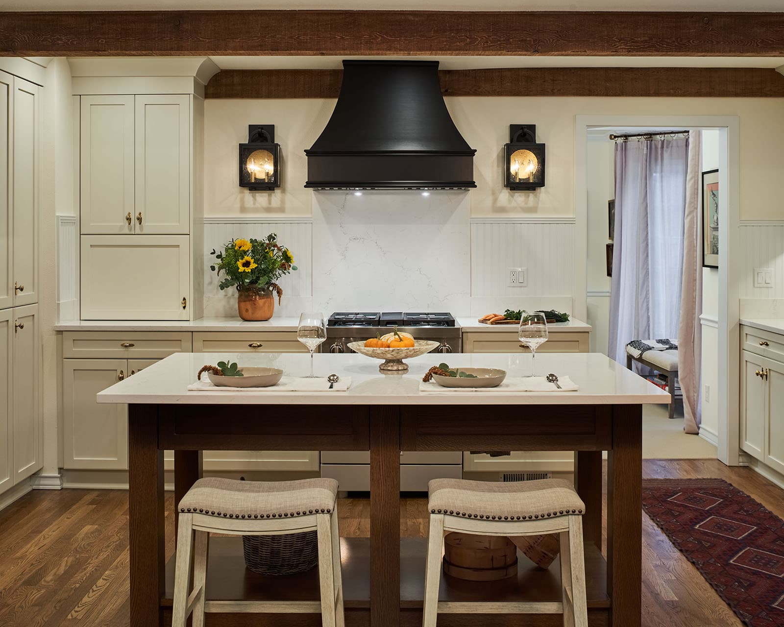 A remodeled kitchen with decorative black hood, New England inspired design.