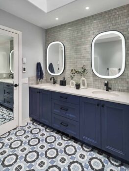 Blue cabinets in a transitional bathroom design