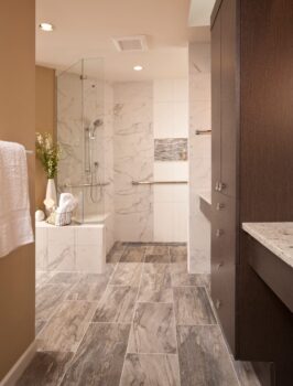 Bellevue Master Bath Seattle 006 Modern accessible design bathroom with roll up sinks, storage, zero threshold walk or roll in shower with bench and grab bars.