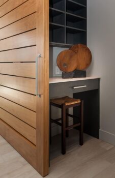 Bend Tetherow Custom Home 011 Modern custom home nook with porcelain tile, and oak barn door.