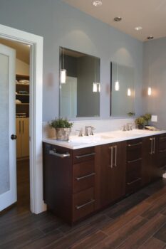 Birdshill Attic Remodel Portland 004 Contemporary style attic remodel bathroom with woodlook tile floor, quartz countertop, dual sinks, and walk-in closet.