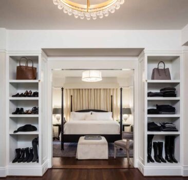 Davis Street Condo Bedroom Portland 012 Remodeled condo bedroom with large four post bed, closet with built in shelves, and finished hardwood floors.