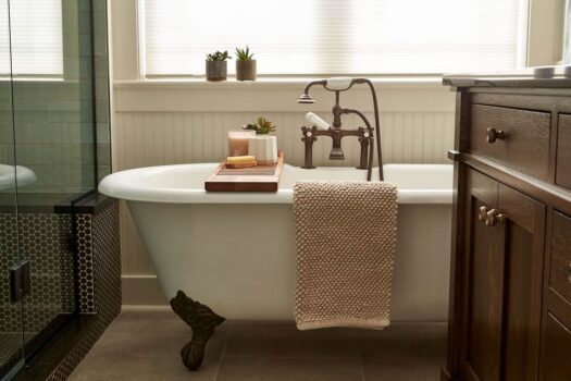 clawfoot bath tub in a remodeled bathroom