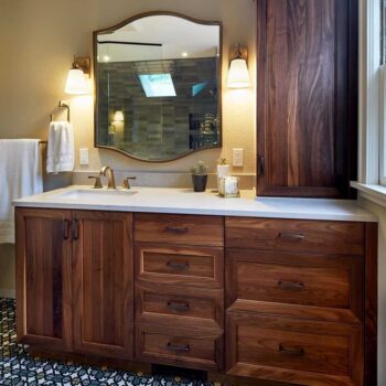 Walnut cabinets in a transitional bathroom in Portland, Oregon
