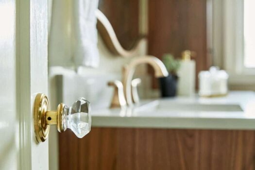 vintage glass doorknob on a bathroom door