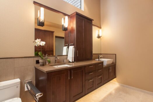 Mt Park Bathroom Portland 005 Accesably designed bathroom with floating cabinet, toe kick lighting, vessel Sink, and fold-down grab bar for toilet.