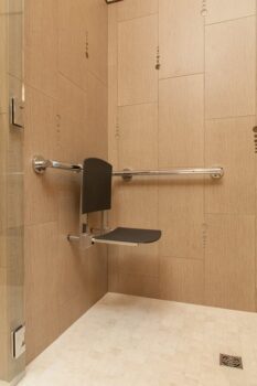 Mt Park Bathroom Portland 013 Accessible design shower with zero threshold wheelchair accessible, grab bars, and hanging shower seat.