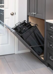 Alt text: Built in laundry storage in primary bathroom remodel