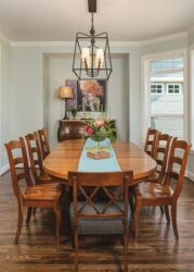 Formal dining room with large dining table and modern lighting