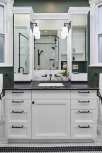 Small Transitional Bath in Northwest Portland, featuring two mirrored cabinets to make the space appear larger.