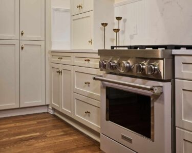 New England inspired kitchen remodel featuring abundant storage.
