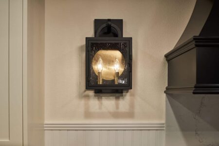 New England inspired kitchen remodel including wall sconces at the range.