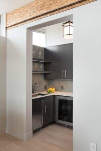 Pantry with Wine Storage and Beverage Refrigerator - Mid Century Inspired Custom Home In Central Oregon