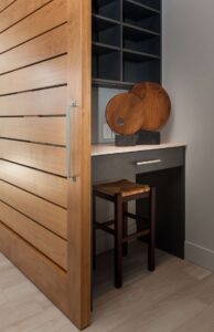 First Floor Hallway with Closet and Media Center - Mid Century Inspired Custom Home In Central Oregon
