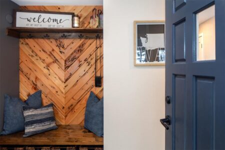 The new entry features a mudroom area with storage options for bags, coats and shoes.