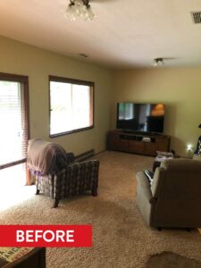 A before photo shows family room next to the kitchen with wall space not being fully utilized.