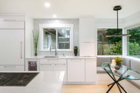 An eating nook just off the kitchen provides extra serving space or intimacy when needed.