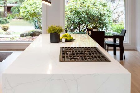 The kitchen island includes a built in range.