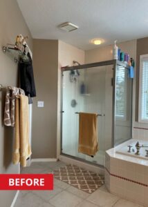 Walk-in shower to the left of a bathtub.