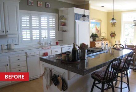 Center kitchen island with two bar stools, quarts countertop, and a gas stove.