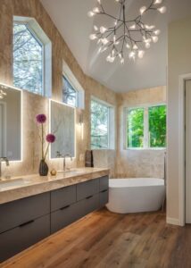 Fluerco Edge Lit vanity mirrors above a double vanity with chrome sinks.