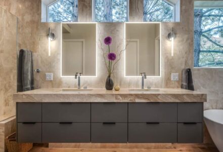 Fluerco Edge Lit vanity mirrors above a double vanity with chrome sinks.