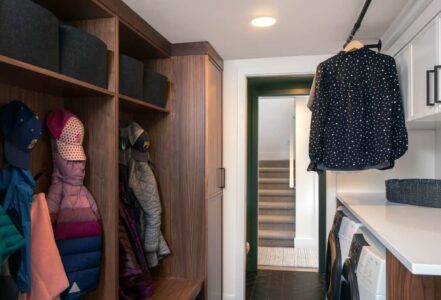 Laundry room with designated wooden storage lockers.