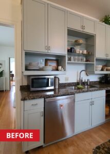 Stainless steel dishwasher built into a kitchen counter space.
