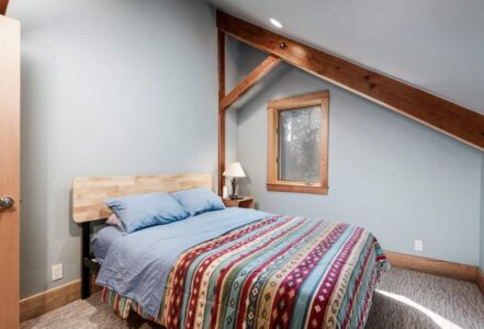 Queen mattress with light blue bedding.