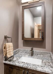 Granite top single-sink bathroom vanity.