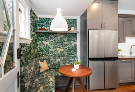 Dining nook with a round wooden table.