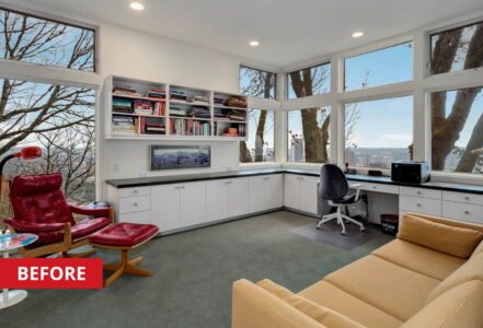 Home office with white office cabinets and a desk built along the wall.
