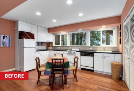 L-Shaped kitchen with a round table with four seats in the middle.