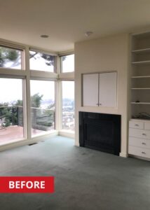 A fireplace in a living room built in to the wall.