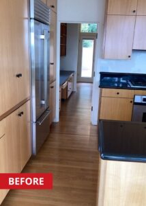 Walking space between a kitchen refrigerator and a kitchen counter.