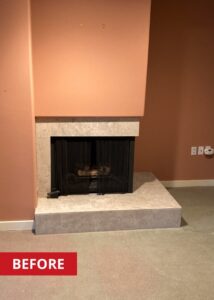 A corner fireplace in a living space.