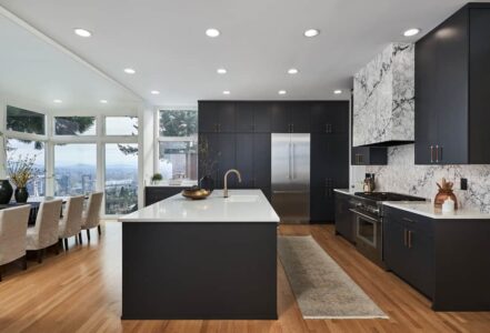 Kitchen island with dark lower cabinets and a PentalQuartz kitchen counter.