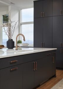 Kitchen island with dark lower cabinets and a PentalQuartz kitchen counter.