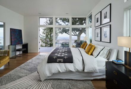 A king bed with a white duvet.