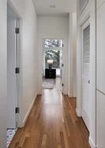 Upstairs hallway with white doors.